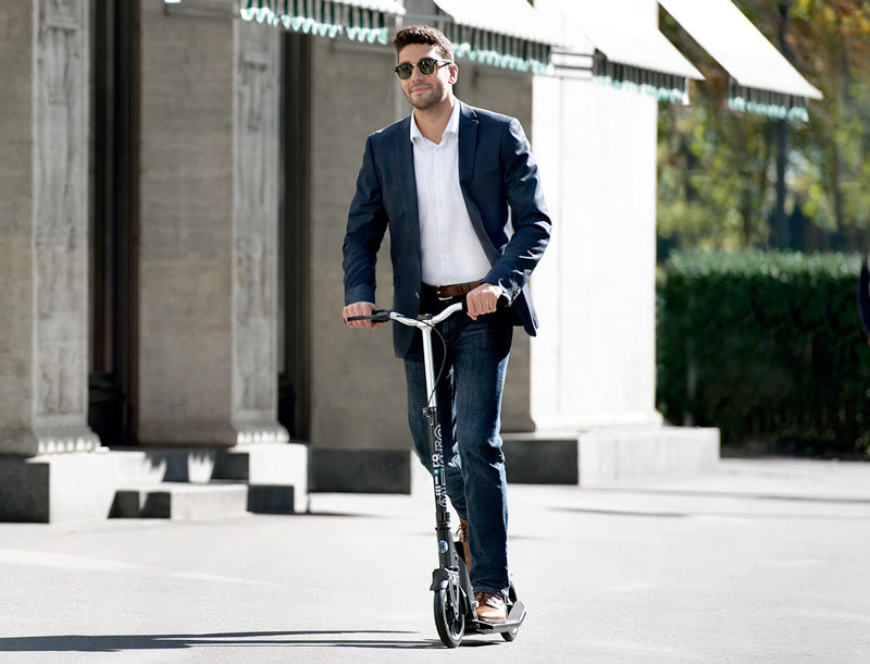Micro Downtown Black kick scooter with rider