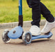 Close up of steering-lock button on Globber Primo Foldable Light three wheel scooter in Blue