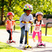 a group of kids riding micro mini deluxe kick scooter